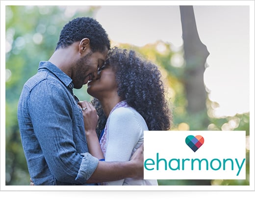 Couple gazing at one another with eHarmony logo overlay